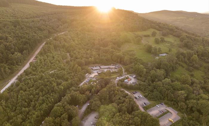 Drone shot of the park with the sun setting behind